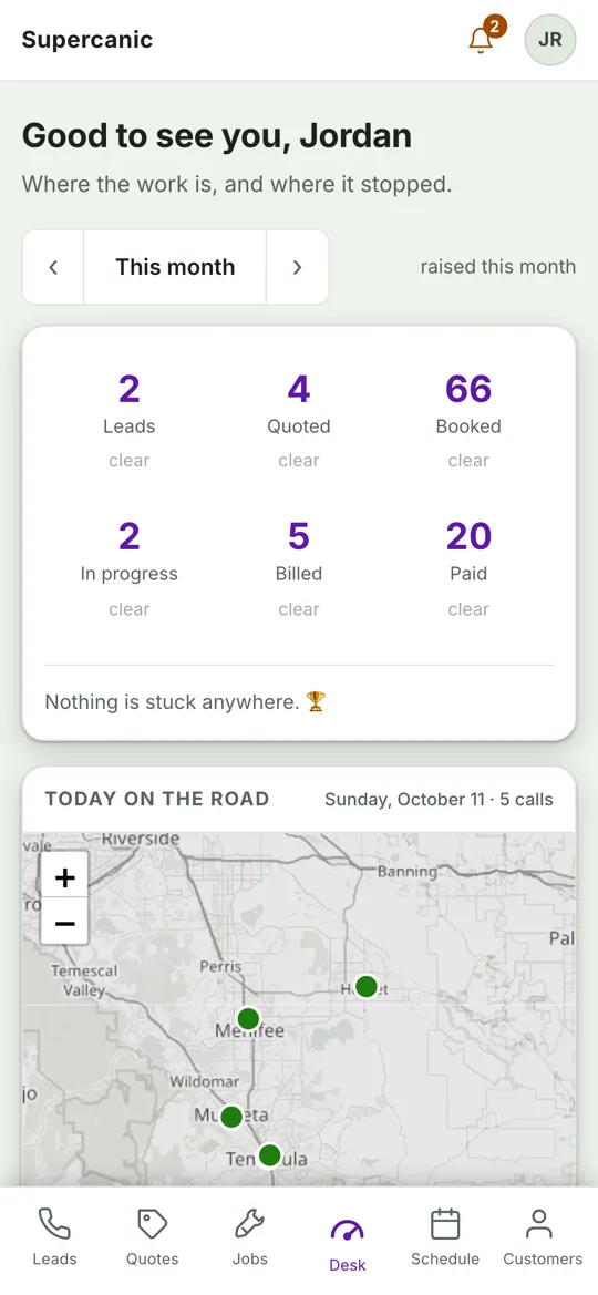 The Shop Desk home screen on a phone with job counts and a map of today's stops